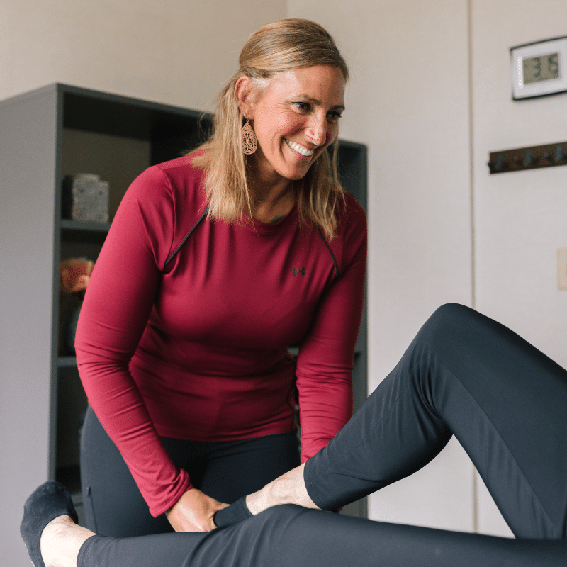 Muscle Activation Techniques Specialist and Athletic Traininer Sarah Gheen working on a client for physical therapy and rehabilitation